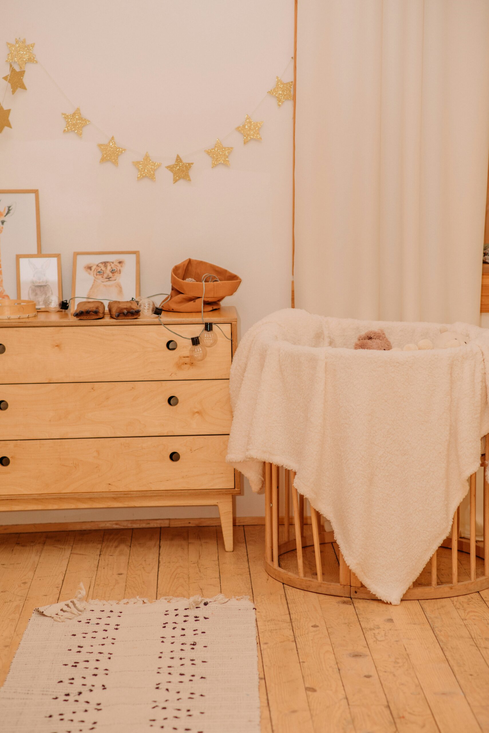 bassinet with wooden dresser in a nursery